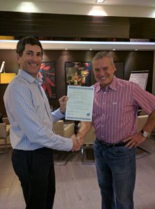 Alan Weiss presents the induction certificate to Shlomo
